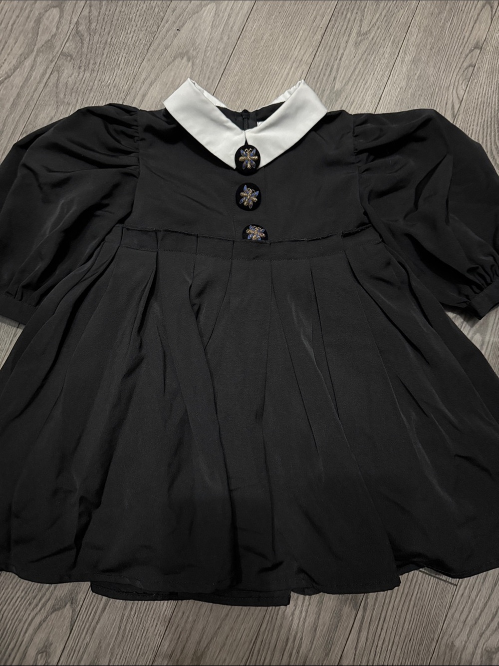 Black Dress with White Peter Pan Collar and Decorative Buttons